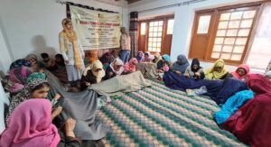 Group of artisans and participants at the Design & Technical Development Workshop reviving Sozni craft through traditional embroidery techniques